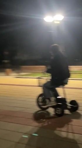 Evening scooter ride and smartphone use in Lozarevo park