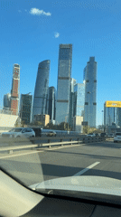 Driver spots Moscow City skyline from highway