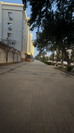 Evening walk through modern Tashkent streetscape with landscaping