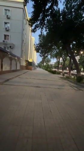 Evening walk through modern Tashkent streetscape with landscaping
