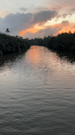 Sunset river scene in Kadewatta with colorful sky