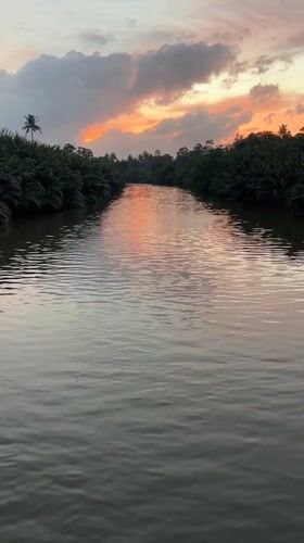 Sunset river scene in Kadewatta with colorful sky