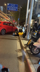Traffic incident involving car and motorcycle in Shanghai intersection