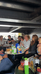 Casual boat gathering drifting through Leiden's canal network