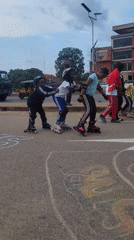 Young people roller skating and skateboarding in Jos streets