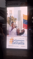 Evening scenes at Caracas bus terminal feature political displays