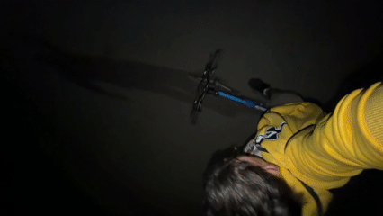 Playful cyclist rides through Blagoevgrad streets at night