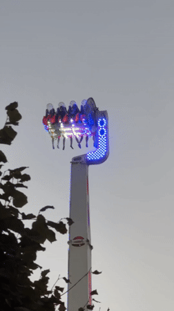 Amusement rides and the Villette dome light up a Paris evening