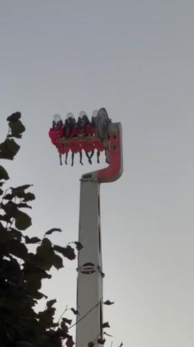 Amusement rides and the Villette dome light up a Paris evening