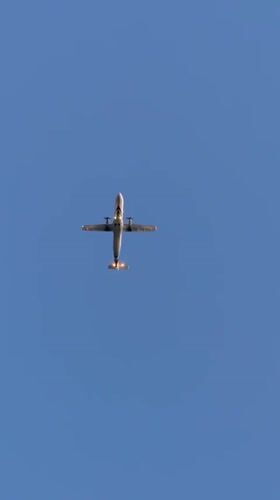 Twin-engine turboprop on approach over Ko Samui skies
