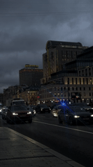 Woman films selfie on busy Moscow street during evening