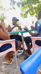 Casual outdoor gathering with games and conversations in Lokoja