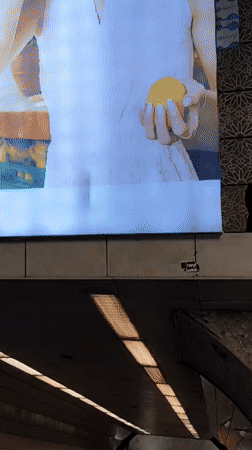 Woman navigates subway station levels in Sarıyer, Turkey