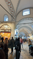 Tourist documents rainy day at Istanbul's Grand Bazaar