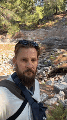 Ancient amphitheater in Fethiye, overgrown but intact
