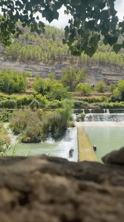 Tiered waterfalls and green river pools near Jorquera, Spain