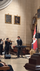 Live music and ornate interiors at San Isidro Church, Lima