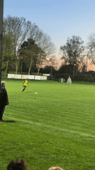 Evening gathering at Wegberg sports field during sunset