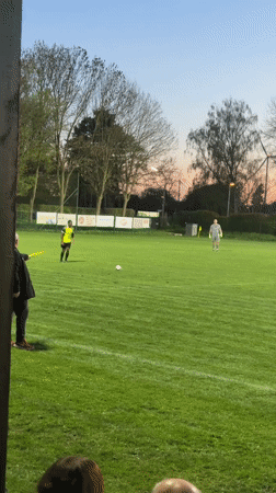 Evening gathering at Wegberg sports field during sunset