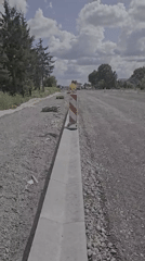 Road construction and open skies along a Latvian roadside