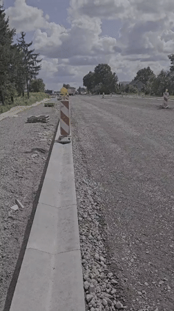 Road construction and open skies along a Latvian roadside