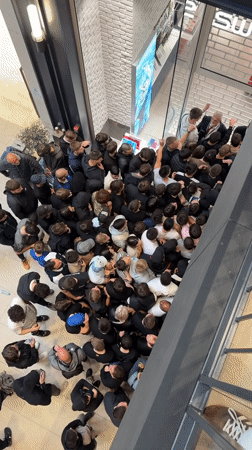Large crowds queue at Belgrade shopping mall near Swatch store