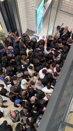 Large crowds queue at Belgrade shopping mall near Swatch store