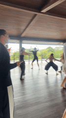 Early morning dance class held at wooden pavilion in Mengwi