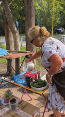 Roadside flea market with produce and books in Samara