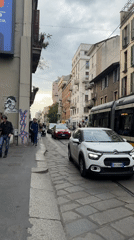 Overcast afternoon street scene observed in Milan, Italy