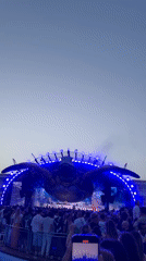 Giant turtle stage sculpture anchors Ibiza festival at dusk