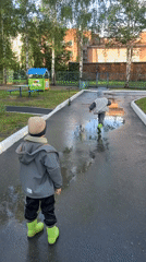Children play in Cheboksary park after afternoon rain
