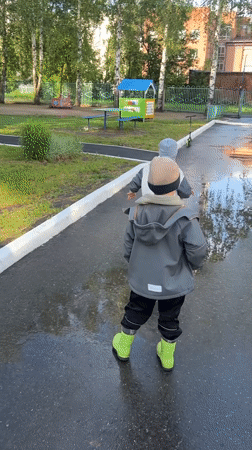 Children play in Cheboksary park after afternoon rain