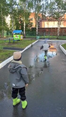 Children play in Cheboksary park after afternoon rain
