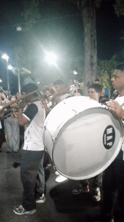 Nighttime religious procession with marching band in Tinaquillo, Venezuela