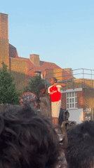 Arsenal fans celebrate in London streets with flags, jerseys