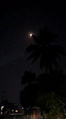 Moonlit street scene documented in rural Indonesia