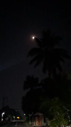 Moonlit street scene documented in rural Indonesia