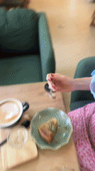 Woman enjoys morning coffee at Choeng Thale cafe