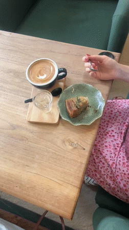 Woman enjoys morning coffee at Choeng Thale cafe