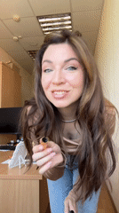 Woman applies makeup during morning routine in Kryvyi Rih