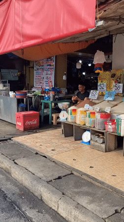 Everyday street life along a busy Davao City road