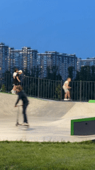 Children play at skate park during evening hours in Lyubertsy