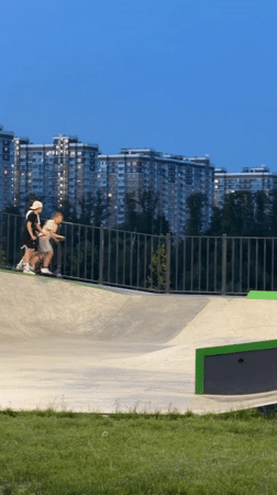Children play at skate park during evening hours in Lyubertsy