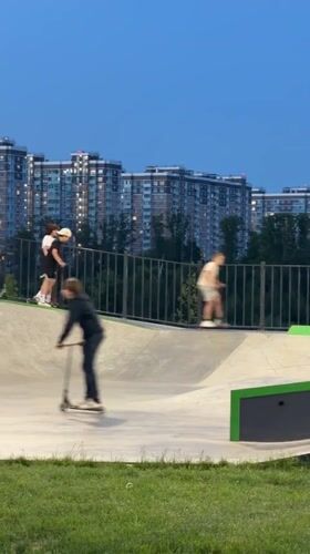 Children play at skate park during evening hours in Lyubertsy