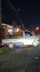Loaded truck with worker spotted on Lhokseumawe street