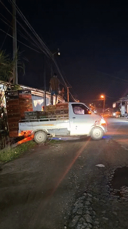 Loaded truck with worker spotted on Lhokseumawe street