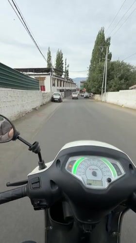 Scooter ride and garbage truck on the streets of Leh
