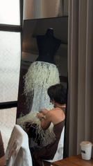 Woman crafts textured white dress in Mengwi workshop