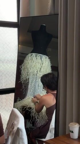 Woman crafts textured white dress in Mengwi workshop